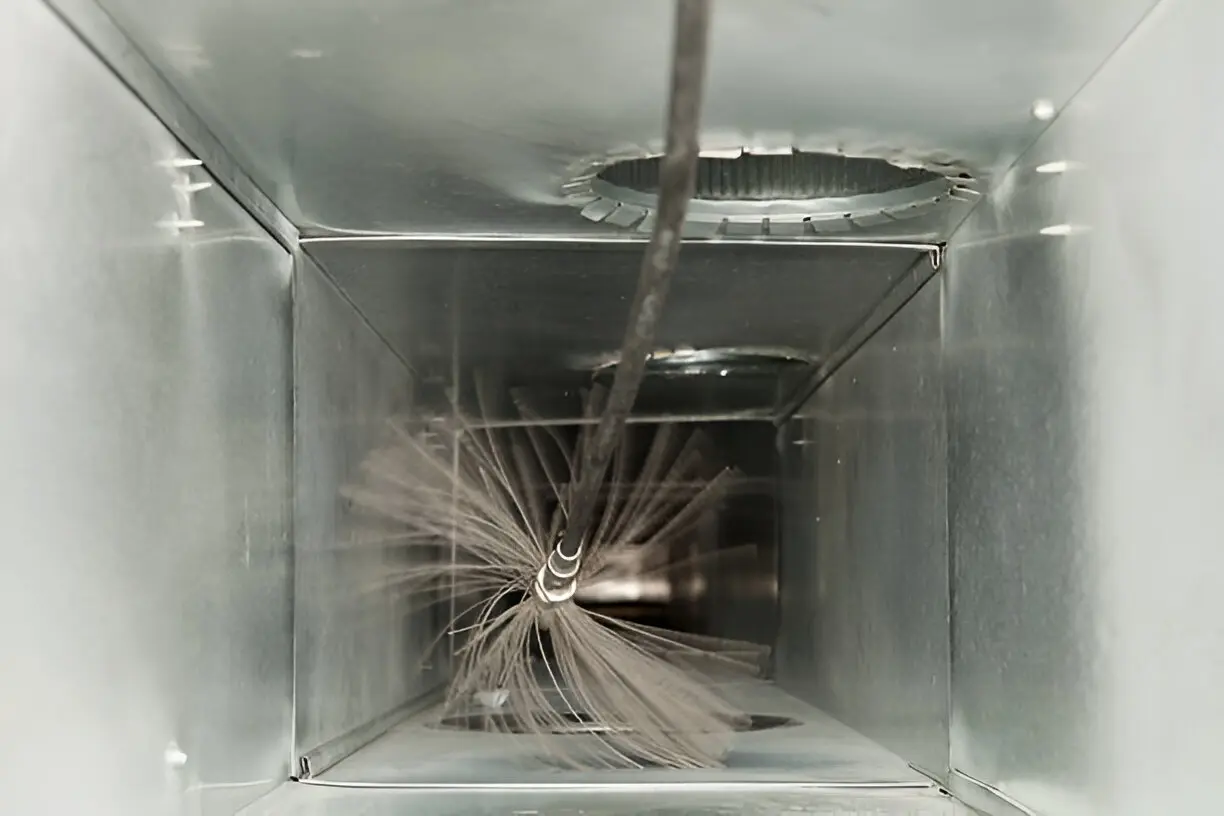 Professional air duct cleaning removing dust and contaminants from HVAC ducts to improve airflow and air quality.