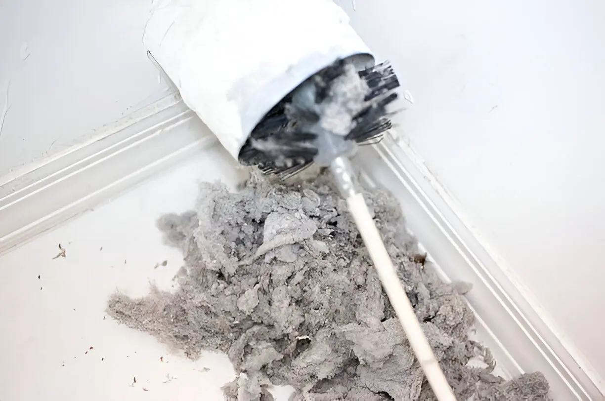 Detailed lint removal during Dryer Vent Cleaning in Gardena to improve dryer efficiency and reduce fire risk.